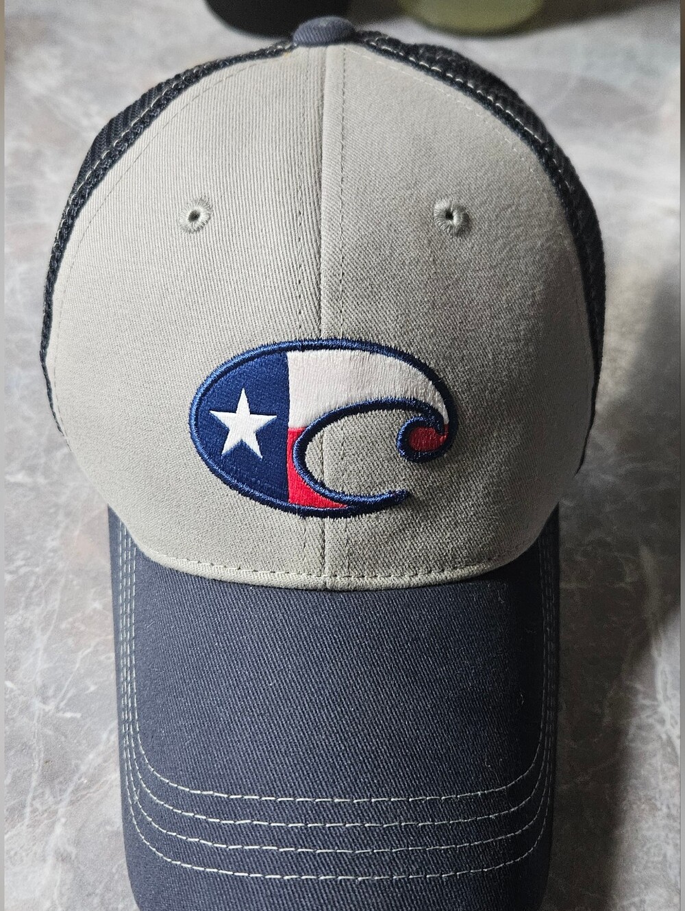 Costa Navy Trucker Hat with White Embroidered Texas Flag Color Logo